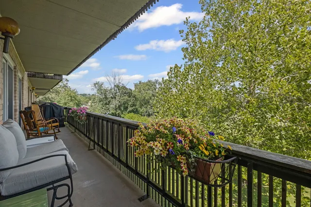 a view of balcony with furniture