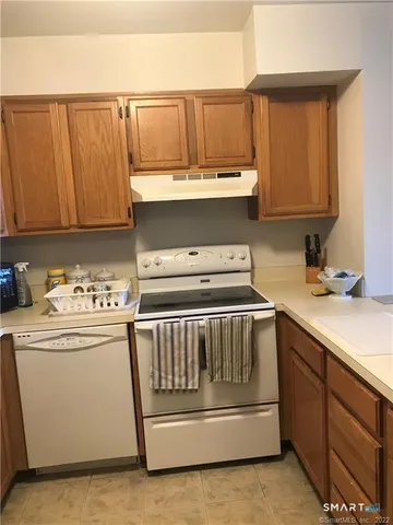 a kitchen with a stove top oven