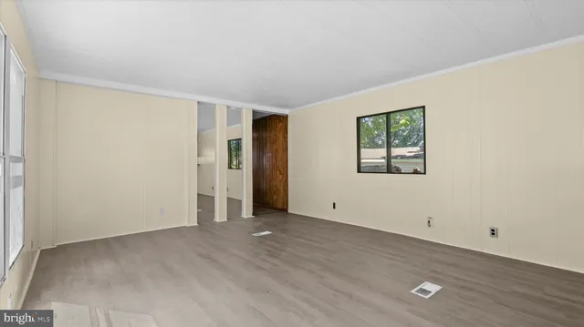 a view of an empty room with a window