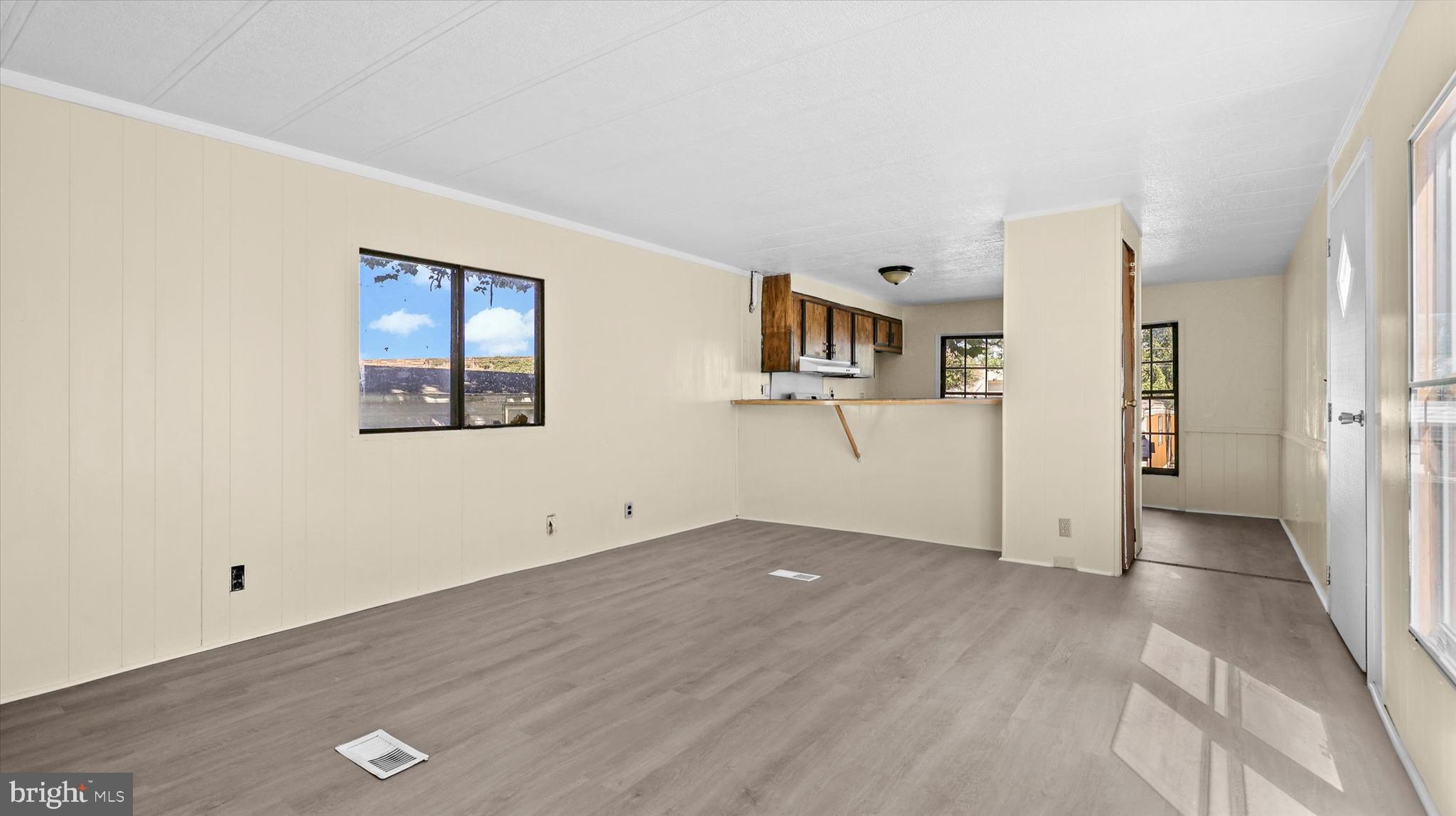 4518 Rolo Court Mechanicsburg, PA 17055 - Photo 4 of 16 a view of a big room with wooden floor and windows