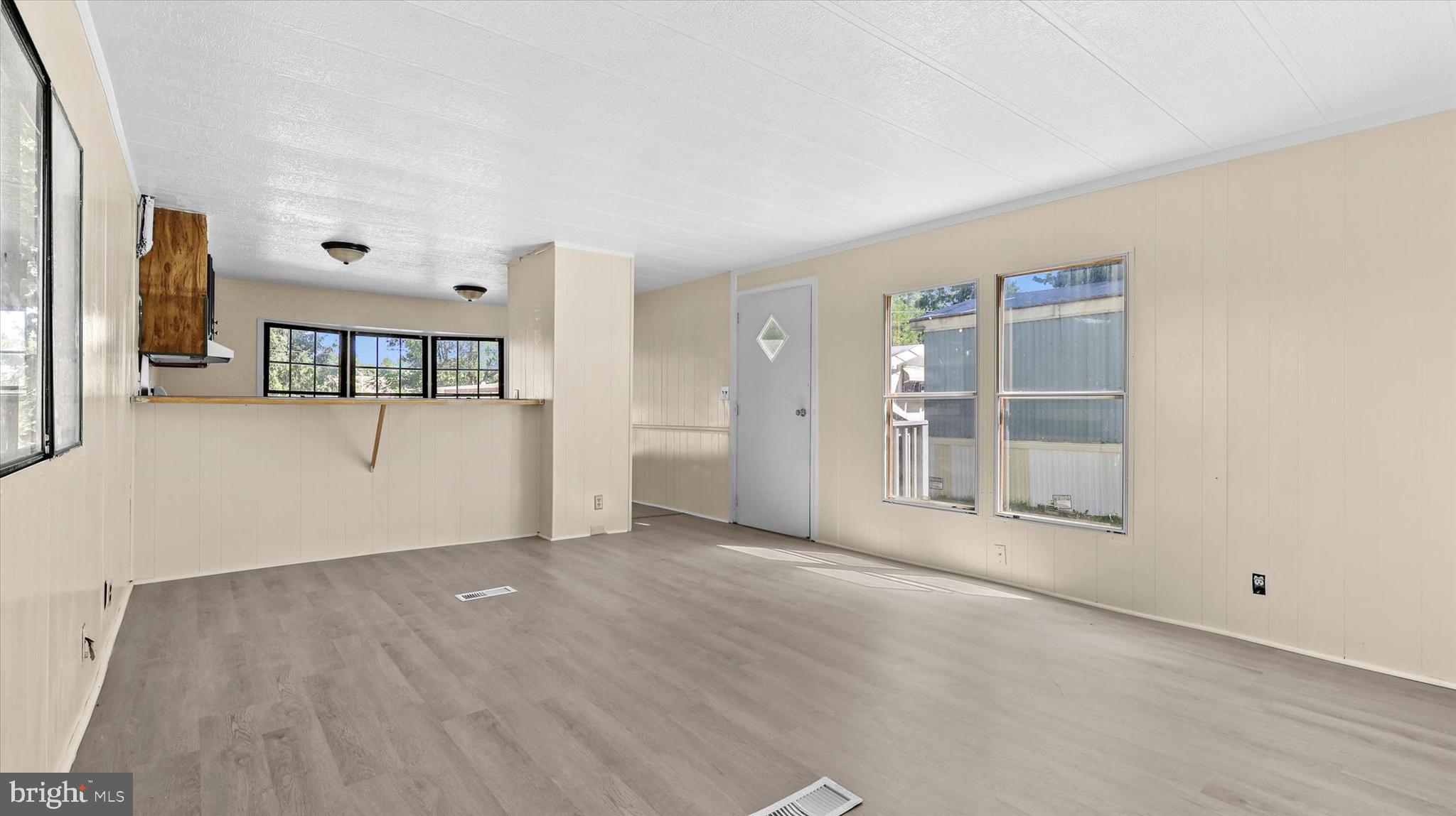 4518 Rolo Court Mechanicsburg, PA 17055 - Photo 5 of 16 wooden floor in an empty room with a window