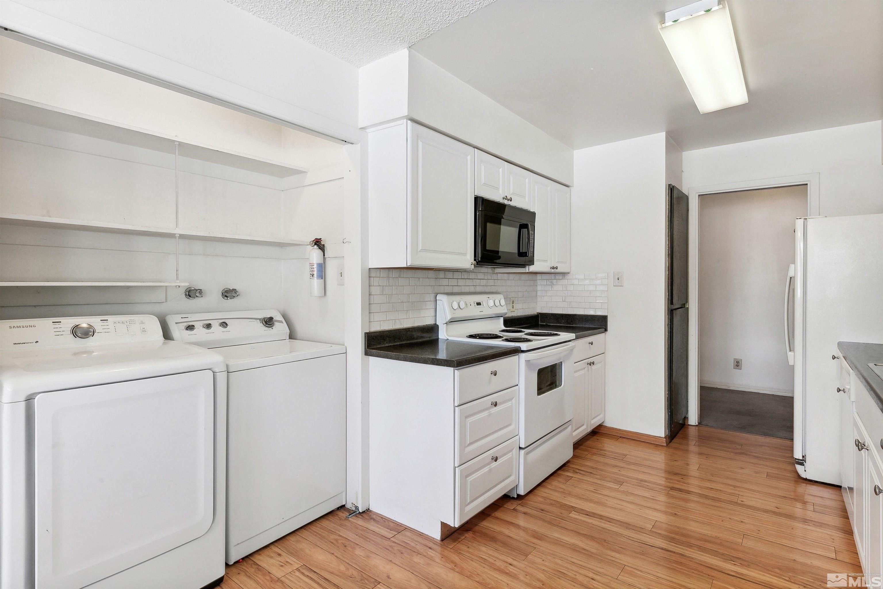 1950 Prince Way Reno, NV 89503 - Photo 12 of 17 a kitchen with a stove and a microwave