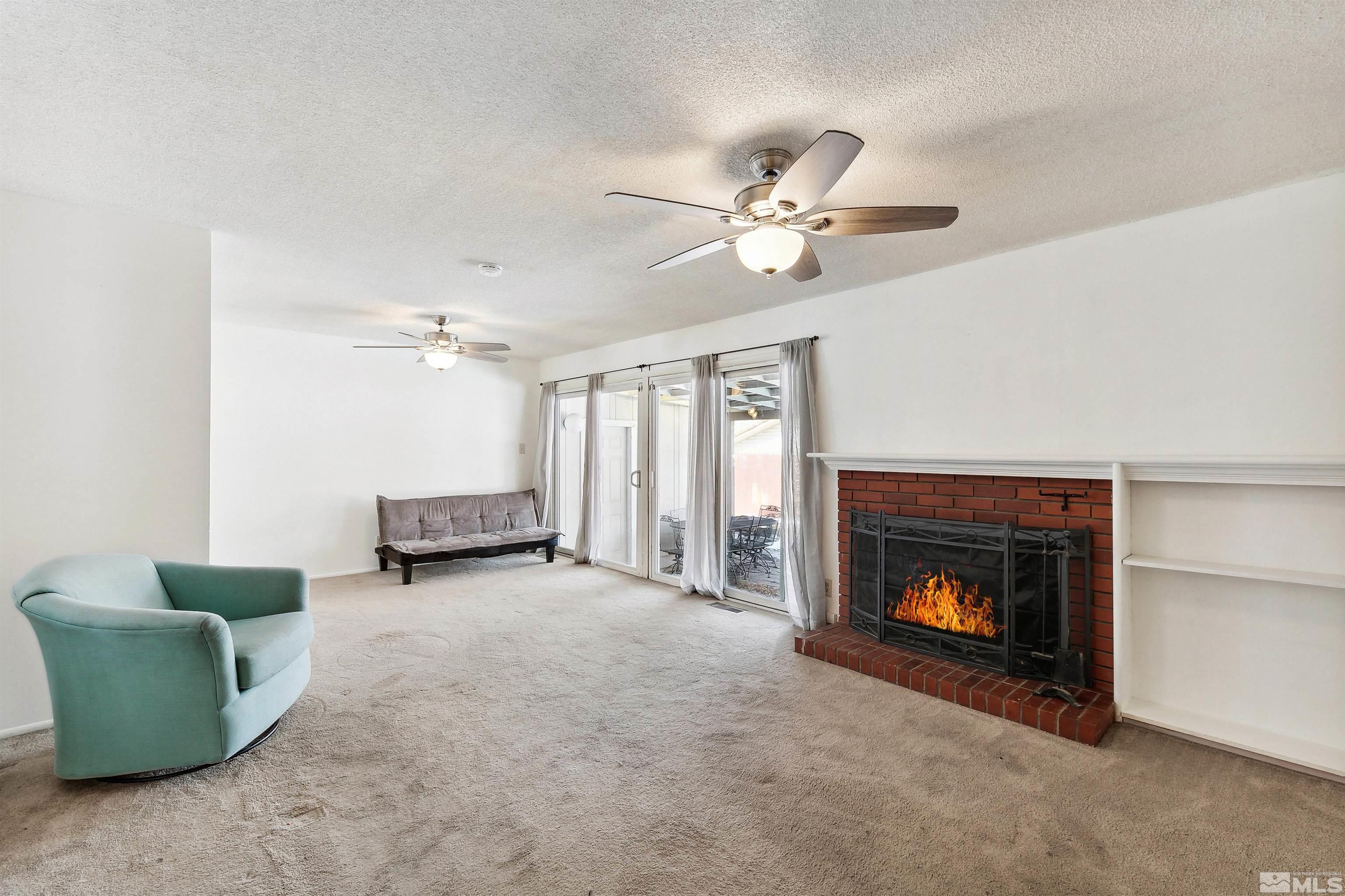 1950 Prince Way Reno, NV 89503 - Photo 13 of 17 a living room with furniture and a fireplace