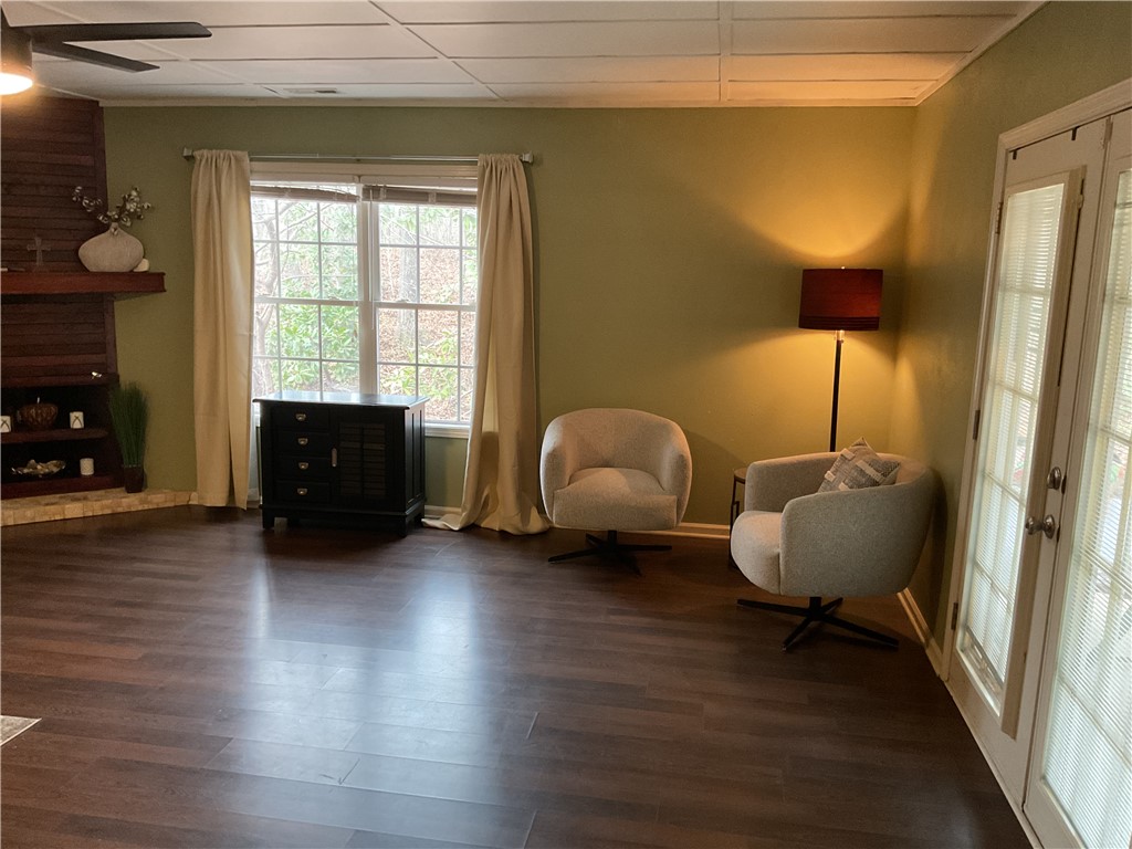 229 Cub Cove Drive Walhalla, SC 29691 - Photo 3 of 50 This inviting living space features warm flooring, a cozy fireplace, and abundant natural light.