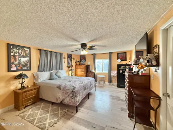 a bed room with a bed and flat screen tv