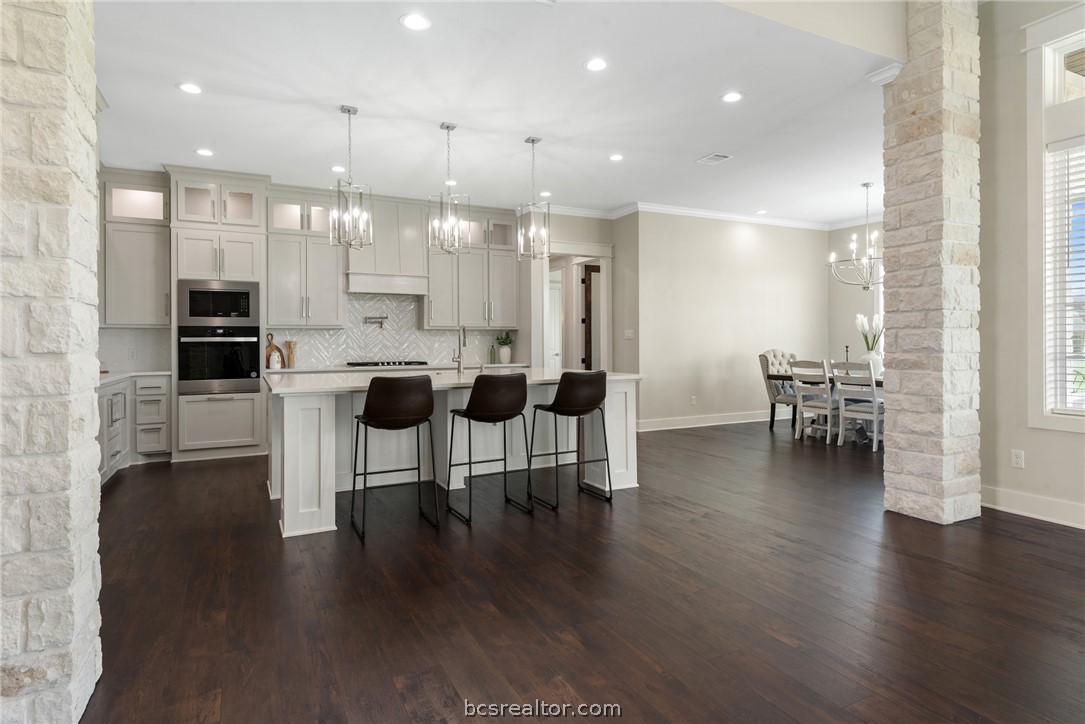 7844 Mathis Crk Drive Bryan, TX 77808 - Photo 12 of 48 a dining room with furniture and wooden floor