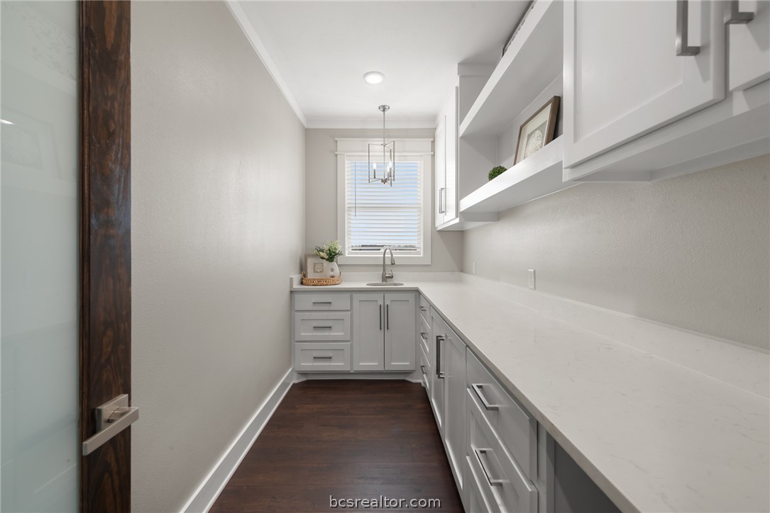 7844 Mathis Crk Drive Bryan, TX 77808 - Photo 19 of 48 a kitchen with cabinets and window