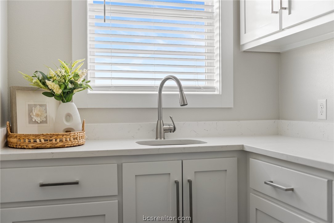 7844 Mathis Crk Drive Bryan, TX 77808 - Photo 20 of 48 a close view of sink and a vanity with potted plant