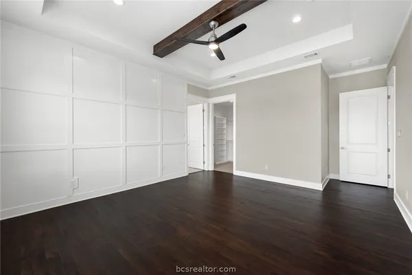an empty room with wooden floor