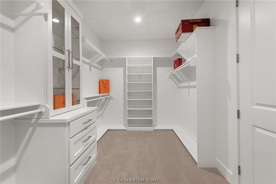 7844 Mathis Crk Drive Bryan, TX 77808 - Photo 24 of 48 a view of walk in closet with empty racks