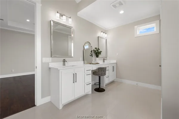 a bathroom with a sink toilet and mirror