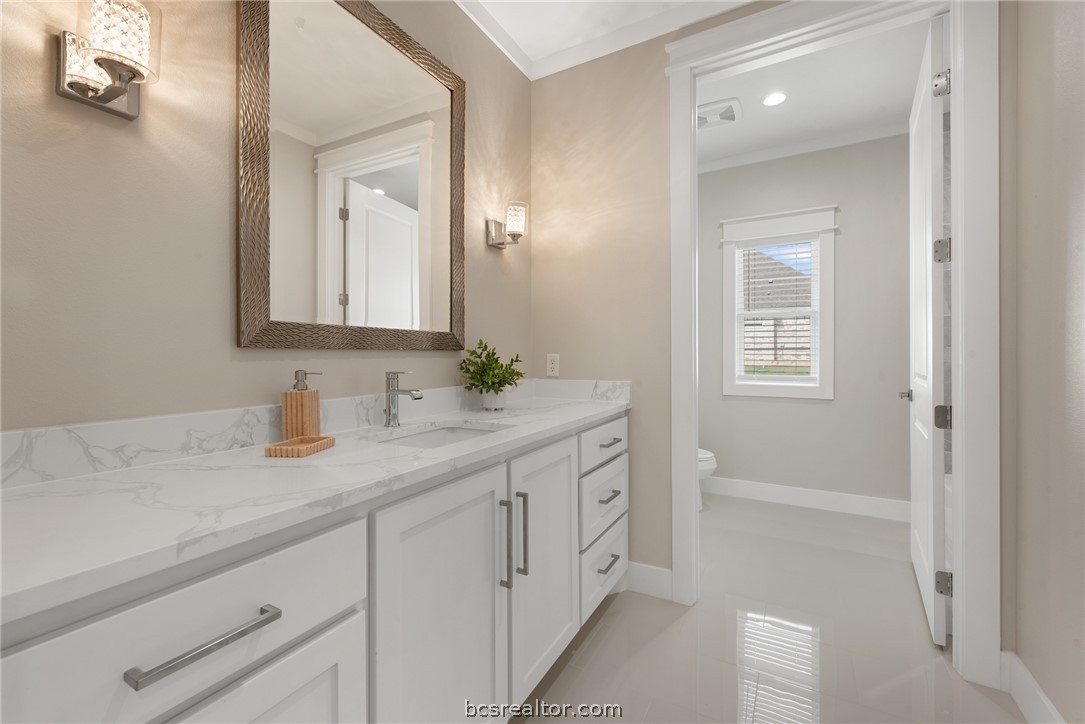 7844 Mathis Crk Drive Bryan, TX 77808 - Photo 38 of 48 a bathroom with a sink and a mirror