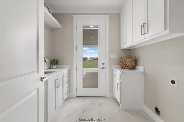 a bathroom with a granite countertop sink and shower