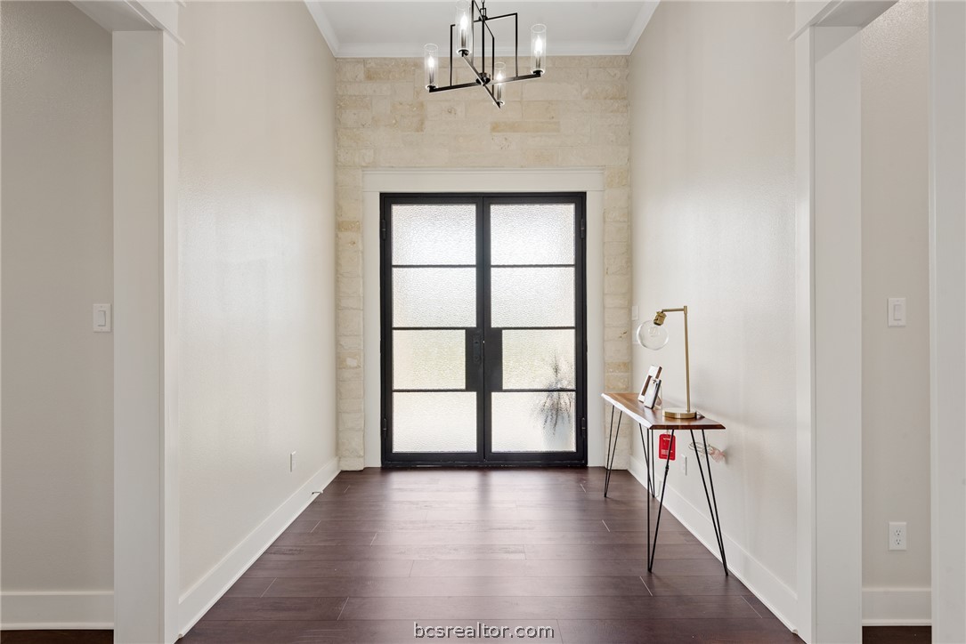 7844 Mathis Crk Drive Bryan, TX 77808 - Photo 6 of 48 wooden floor in an empty room with a window