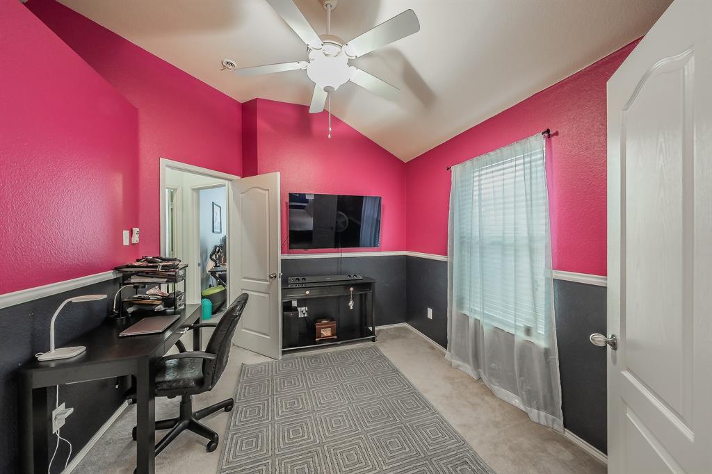 8312 Trinity Vista Trail Hurst, TX 76053 - Photo 26 of 37 Office with vaulted ceiling, light colored carpet, ceiling fan, and a textured wall