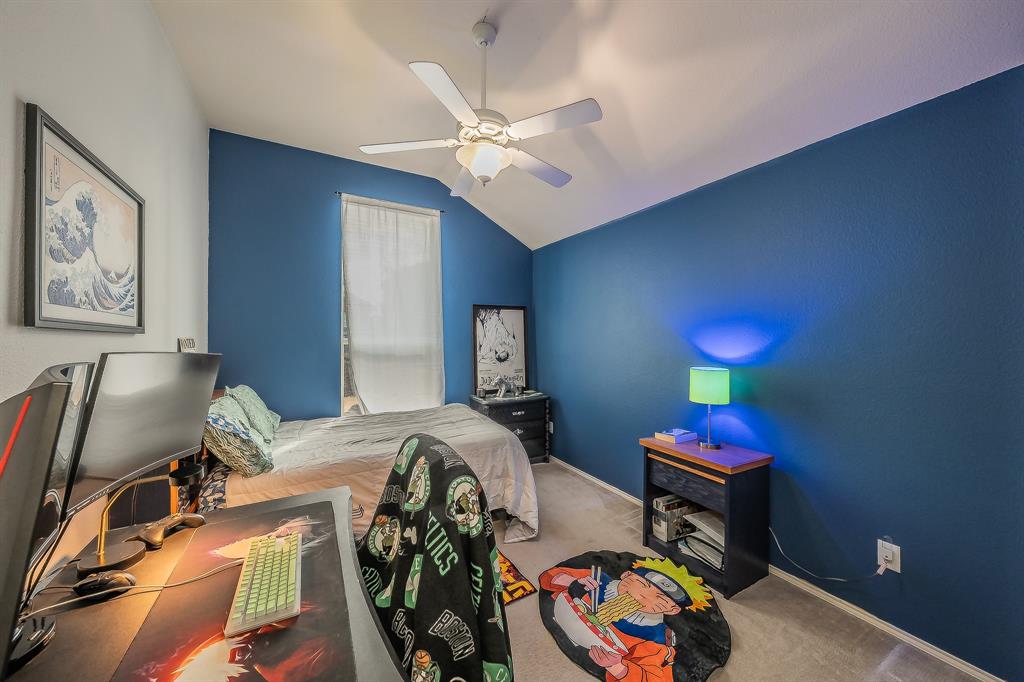8312 Trinity Vista Trail Hurst, TX 76053 - Photo 30 of 37 Bedroom with lofted ceiling, a ceiling fan, and carpet