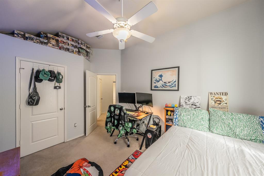 8312 Trinity Vista Trail Hurst, TX 76053 - Photo 32 of 37 Carpeted bedroom with an office area and a ceiling fan