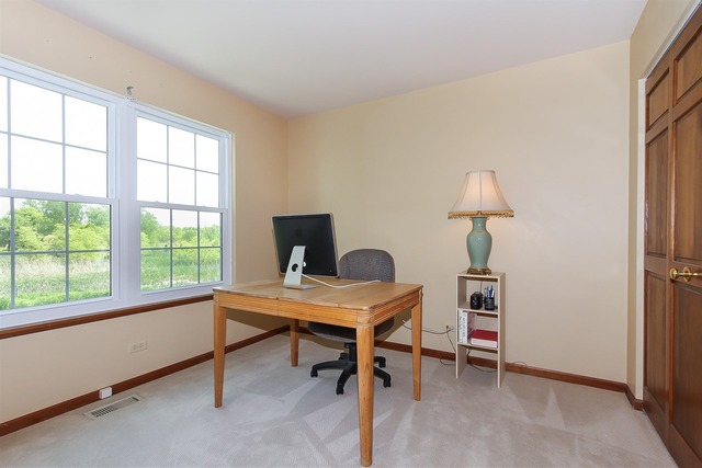 1230 Coldspring Road, Unit 1230 Elgin, IL 60120 - Photo 16 of 21 a view of a workspace with furniture and a window