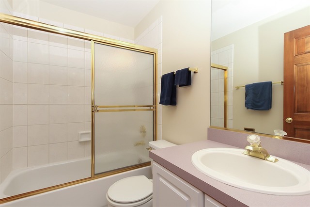 1230 Coldspring Road, Unit 1230 Elgin, IL 60120 - Photo 17 of 21 a bathroom with a sink toilet and shower