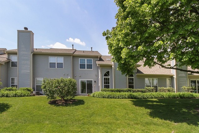 1230 Coldspring Road, Unit 1230 Elgin, IL 60120 - Photo 21 of 21 a front view of a house with a yard