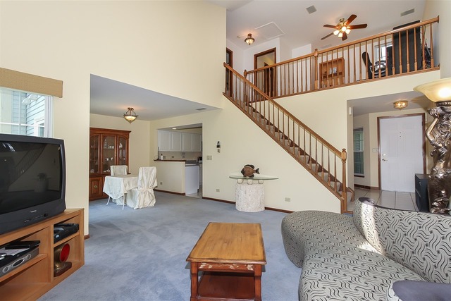 1230 Coldspring Road, Unit 1230 Elgin, IL 60120 - Photo 5 of 21 a living room with furniture and a flat screen tv