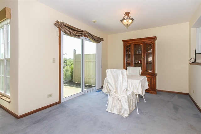 1230 Coldspring Road, Unit 1230 Elgin, IL 60120 - Photo 6 of 21 a very nice looking room with a large window