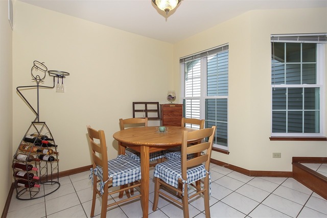 1230 Coldspring Road, Unit 1230 Elgin, IL 60120 - Photo 10 of 21 a dining room with furniture and window