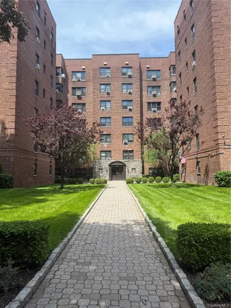 a view of a building with a yard