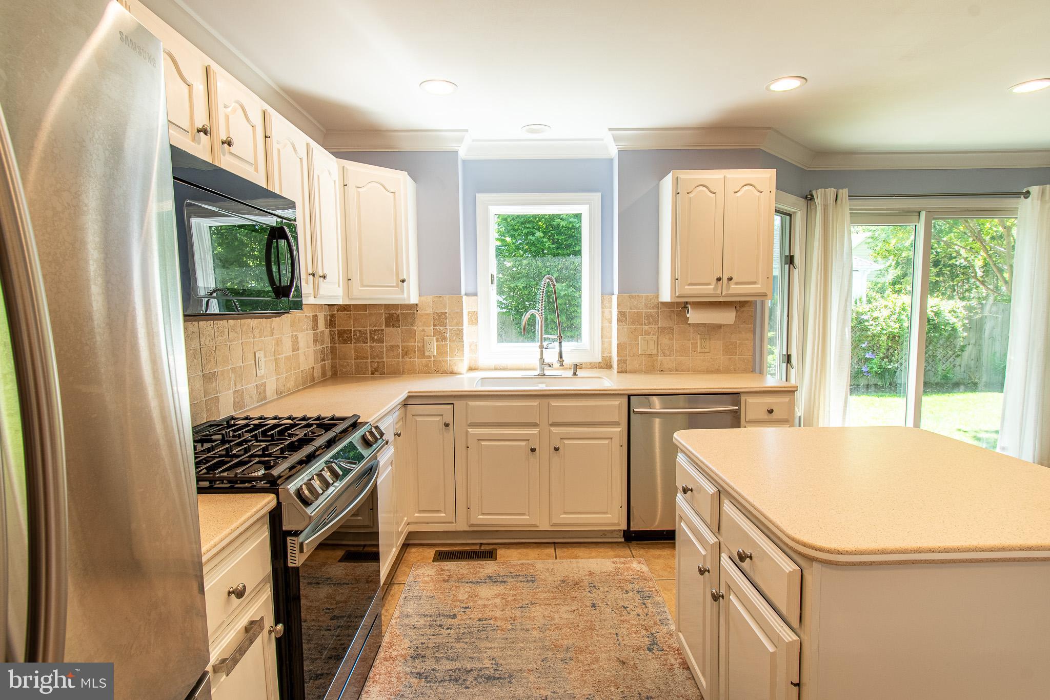102 Jacks Point Road Oxford, MD 21654 - Photo 21 of 83 a kitchen with a stove a sink and a refrigerator
