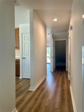 a large kitchen with stainless steel appliances granite countertop a stove and a sink