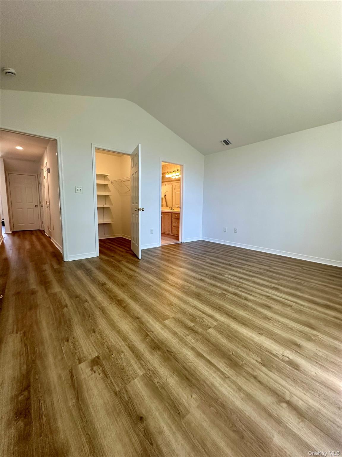 1403 Pebble Beach Path Riverhead, NY 11901 - Photo 17 of 35 Primary bedroom featuring walk in closet, and large primary bathroom.