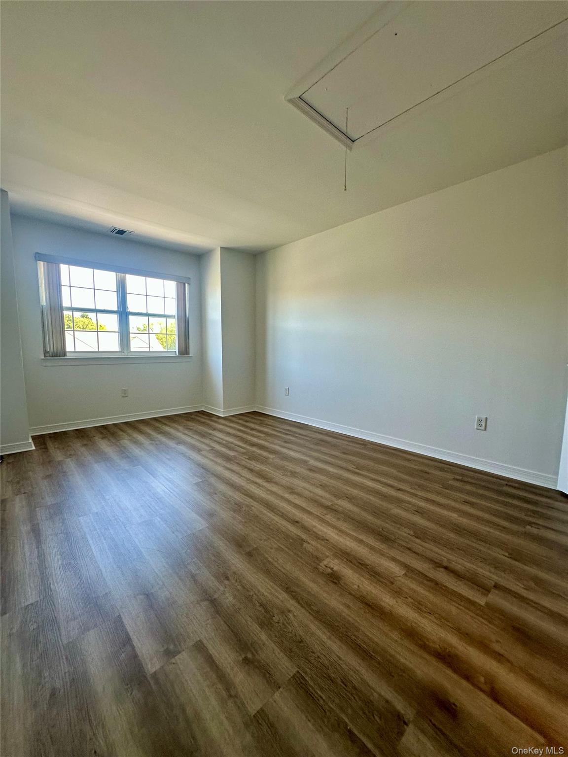 1403 Pebble Beach Path Riverhead, NY 11901 - Photo 22 of 35 Upstairs bedroom with natural light from windows.