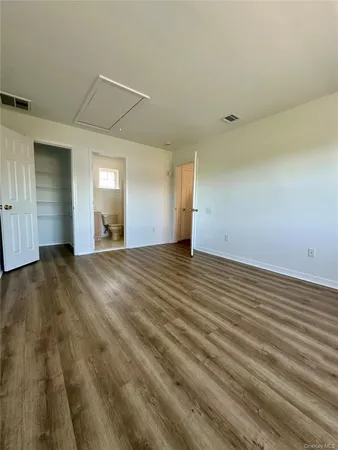 a view of a room with a wooden floor