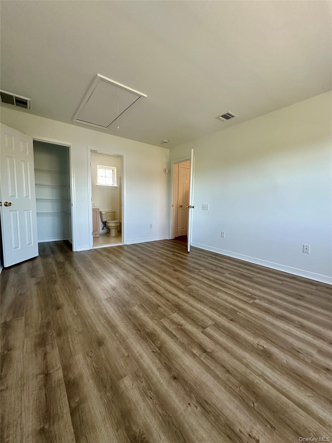 1403 Pebble Beach Path Riverhead, NY 11901 - Photo 24 of 35 Upstairs bedroom with large closet and access to partial attic for additional storage.