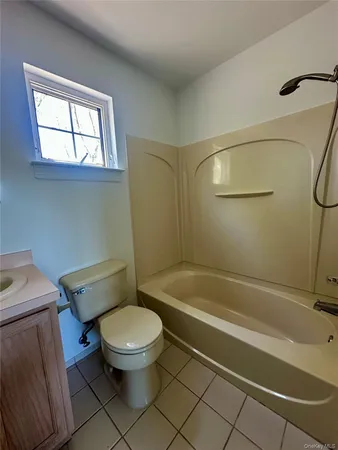 a bathroom with a toilet and a sink