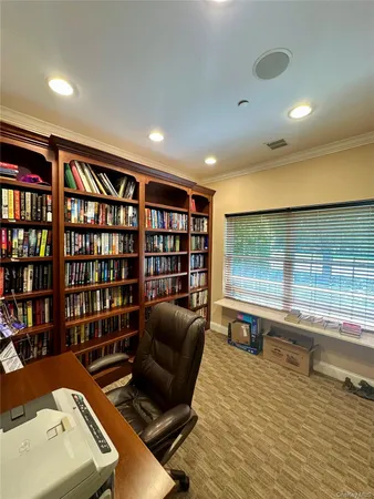 a living room with lots of furniture and a table