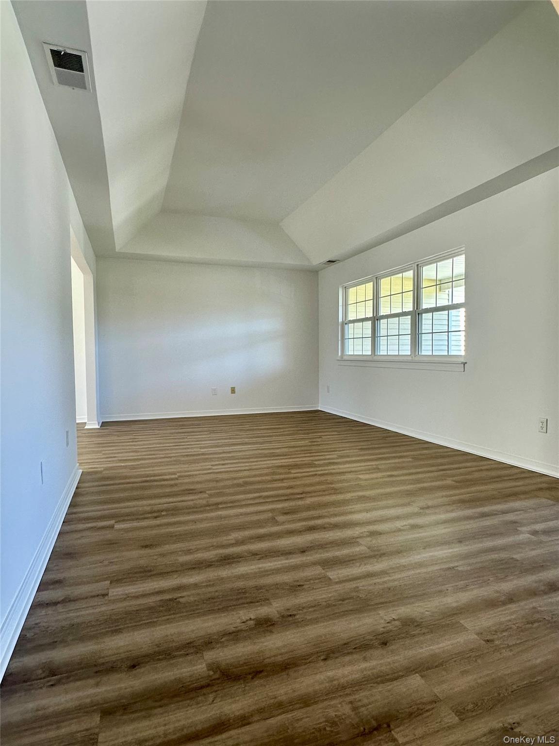1403 Pebble Beach Path Riverhead, NY 11901 - Photo 5 of 35 Primary living room with abundant natural light, access to formal dining area.