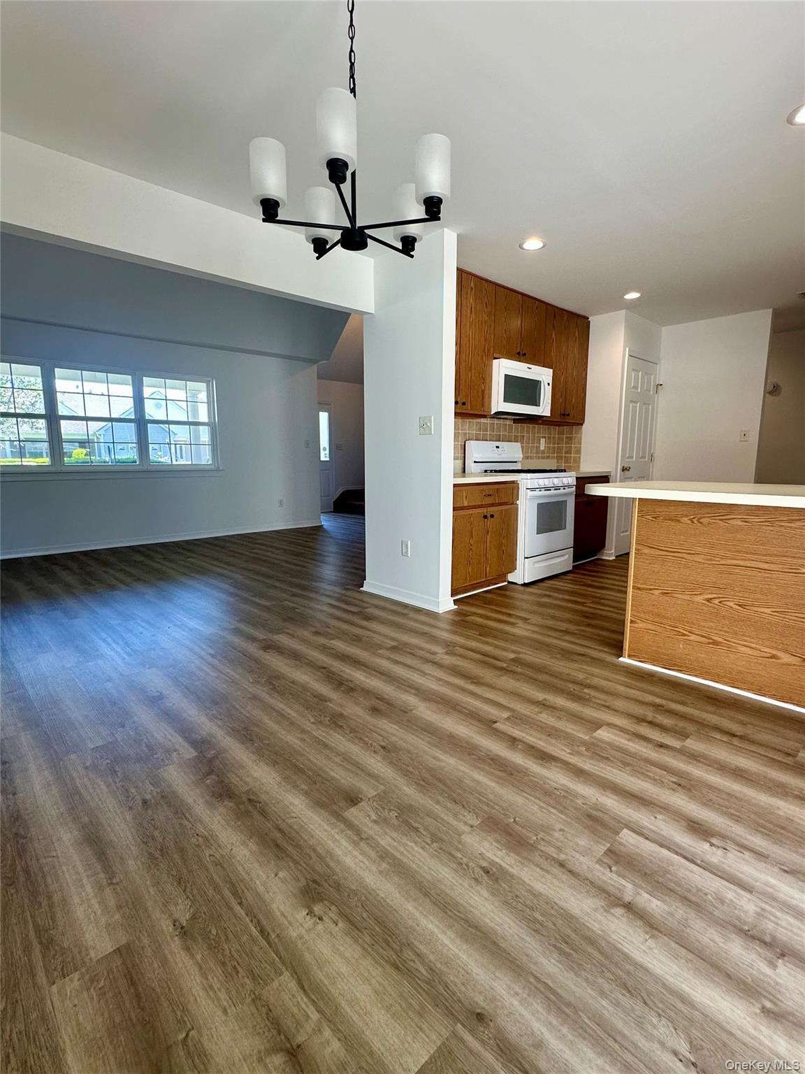 1403 Pebble Beach Path Riverhead, NY 11901 - Photo 9 of 35 Formal dining area with access to kitchen and back patio.