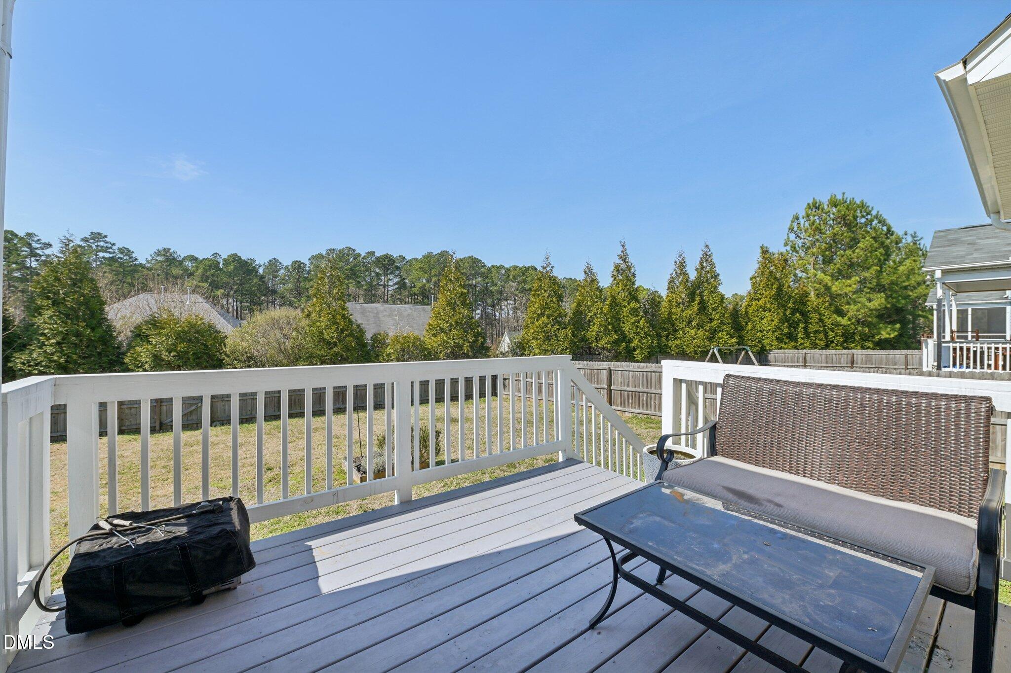 11 Hidden Ridge Court Durham, NC 27707 - Photo 28 of 30 a view of a wooden deck with a bench