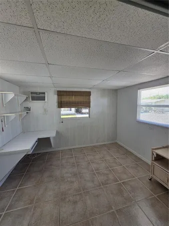 a view of empty room with windows