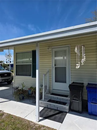a view of house with outdoor space and seating space