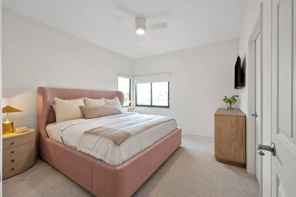 a bed room with a bed and a television