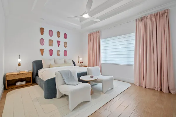 a bedroom with a bed and a lamp