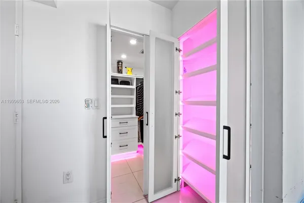 a bedroom with a bed and a cabinets