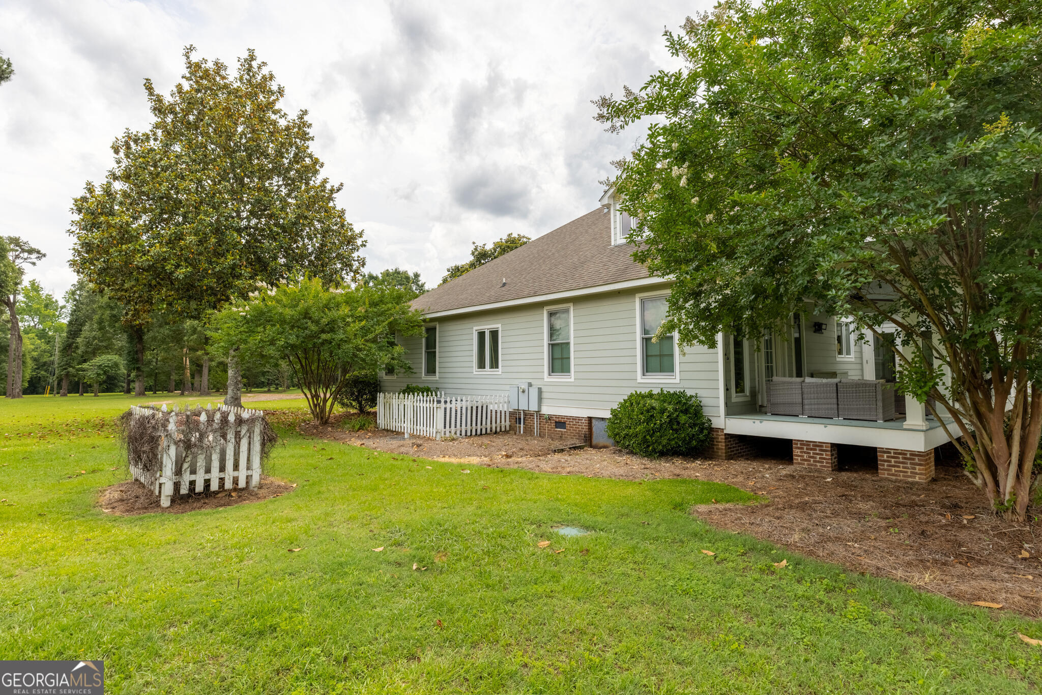 1859 Upper River Road Americus, GA 31709 - Photo 15 of 47 a view of a house with a yard and sitting area