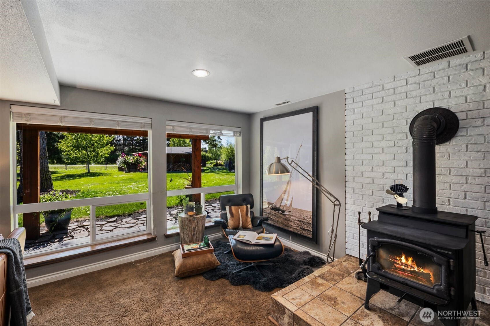 734 Shore Road Port Angeles, WA 98362 - Photo 23 of 40 a living room with furniture and a fireplace