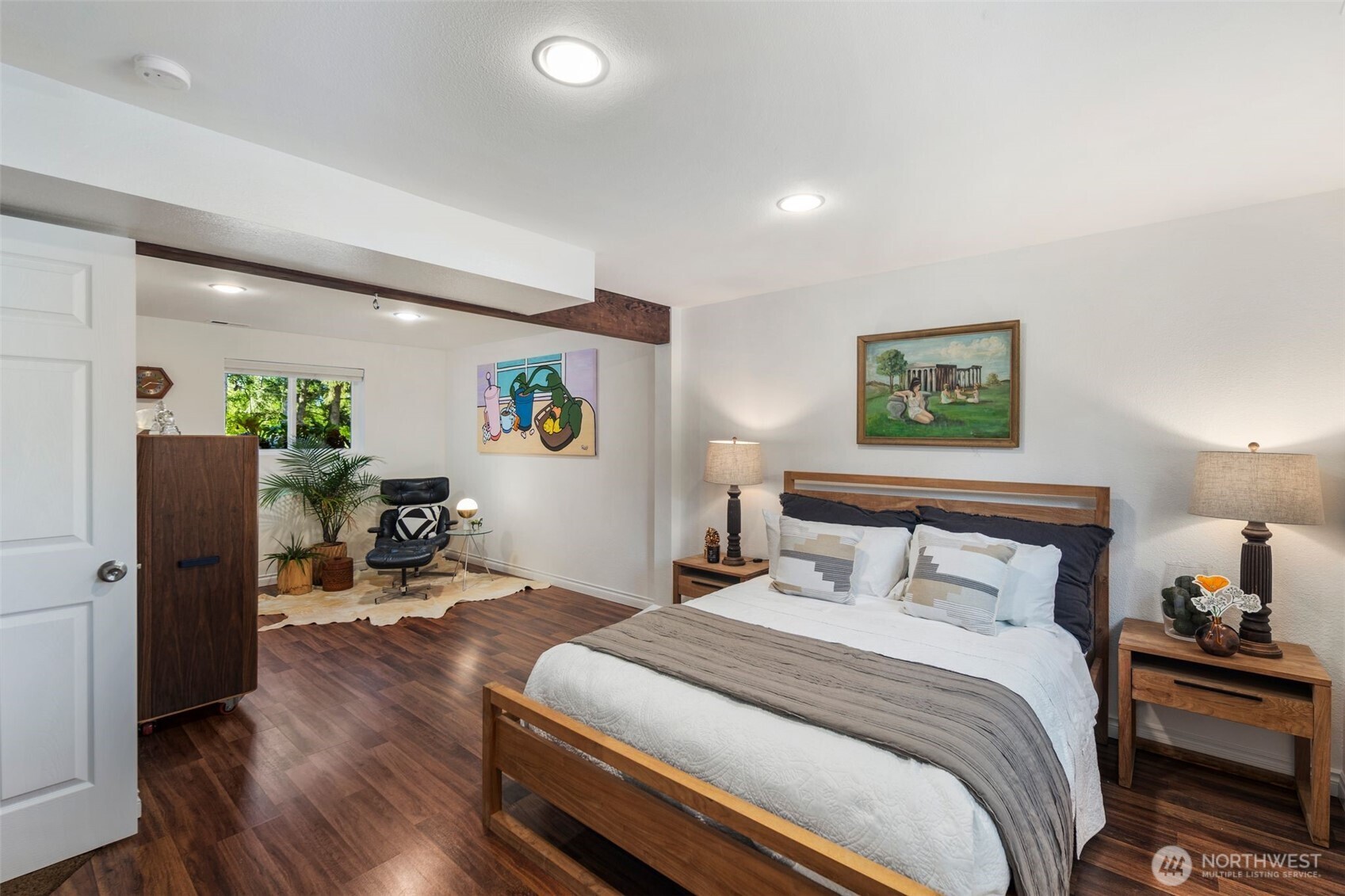 734 Shore Road Port Angeles, WA 98362 - Photo 26 of 40 a bedroom with a bed and wooden floor