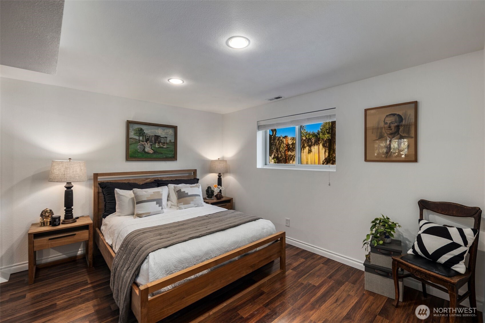 734 Shore Road Port Angeles, WA 98362 - Photo 27 of 40 a bedroom with a bed and wooden floor