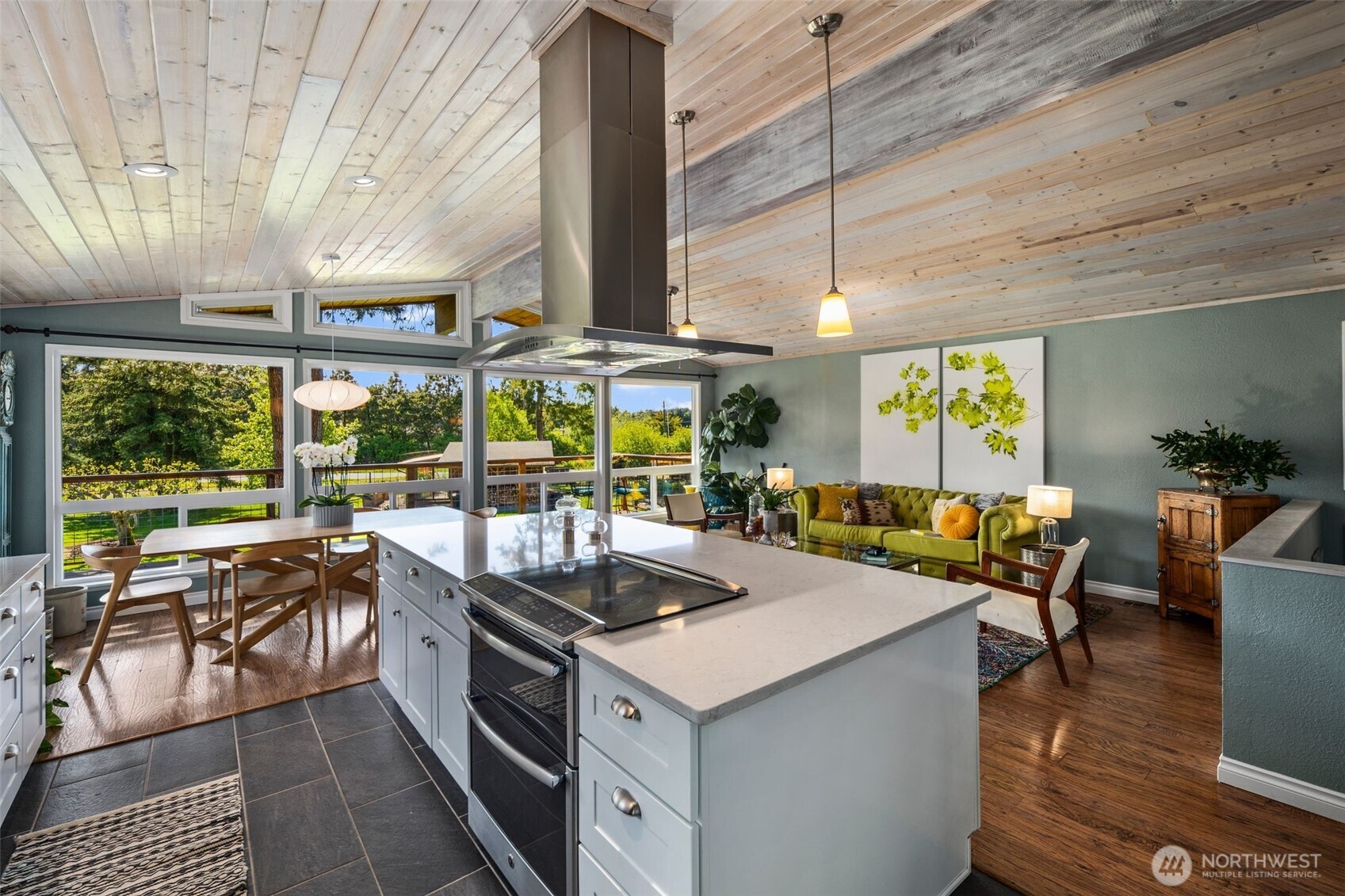 734 Shore Road Port Angeles, WA 98362 - Photo 9 of 40 a kitchen with stainless steel appliances granite countertop a sink and wooden floors