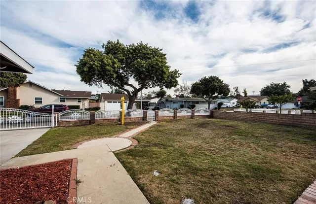 a view of a yard with swimming pool